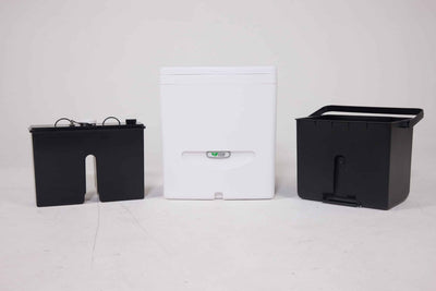 Cuddy™ Lite compost bin with liquids bottle and solids collection bin, designed for eco-friendly waste separation.