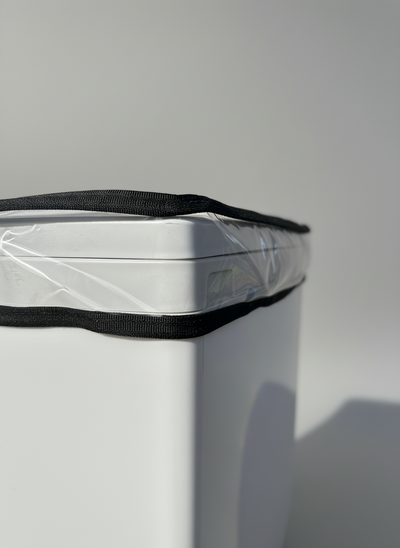 Compo Closet Australia Cuddy™ Shower Cap in navy blue with elastic edge for secure fit, shown on a bathroom shelf.