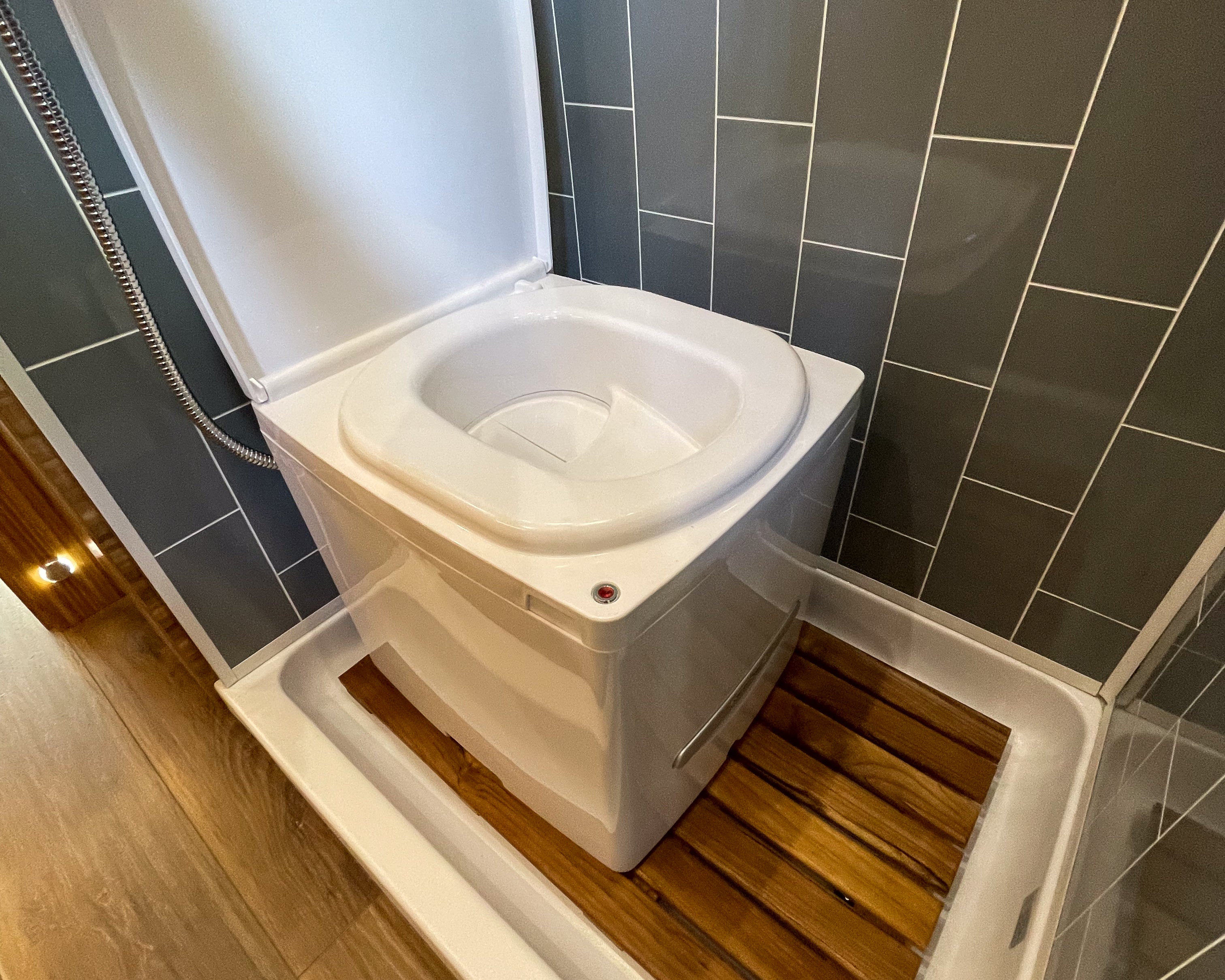 Portable Cuddy composting toilet by Compo Closet Australia, designed for caravan and off-grid living, featuring a compact, eco-friendly design.