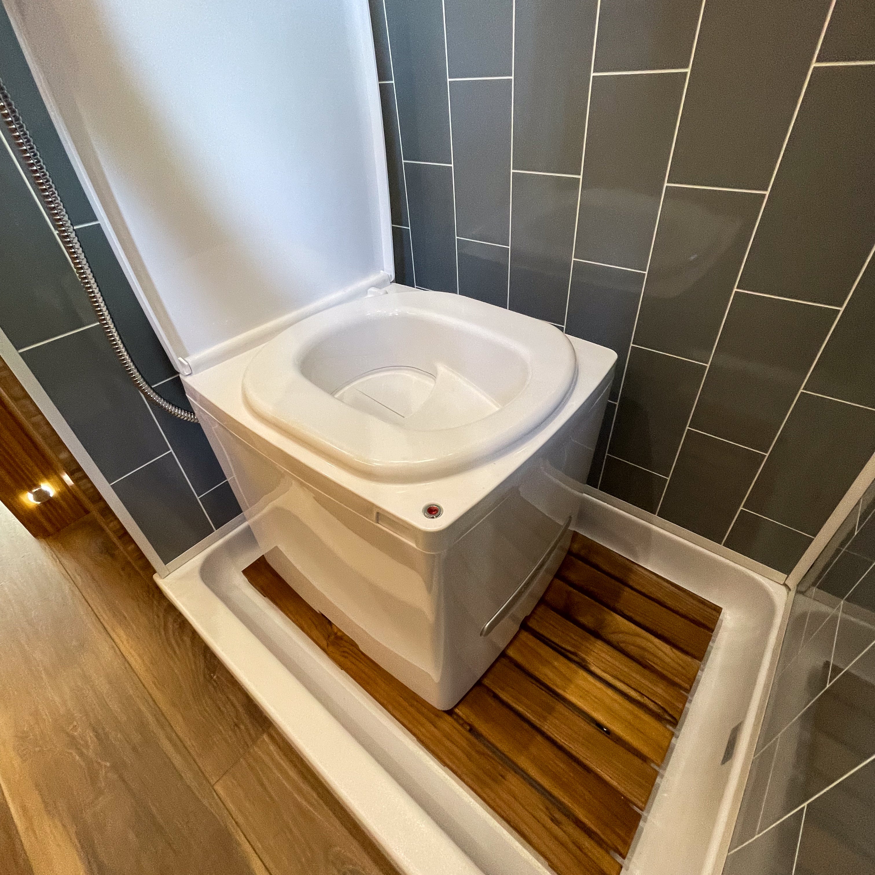 Portable Cuddy composting toilet by Compo Closet Australia, designed for caravan and off-grid living, featuring a compact, eco-friendly design.